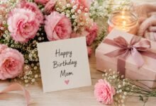 Happy Birthday Mom card with pink flowers, gift and candlelight