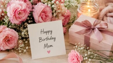 Happy Birthday Mom card with pink flowers, gift and candlelight